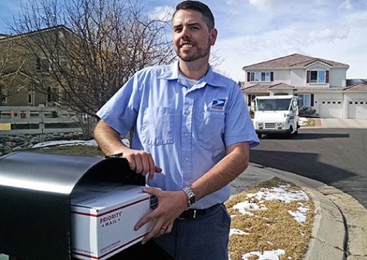 Broomfield, CO, Letter Carrier J.D. Kohl stands near one of the test mailboxes. Click on the imager for a larger version