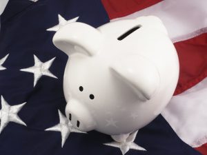Piggy Bank Over American Flag