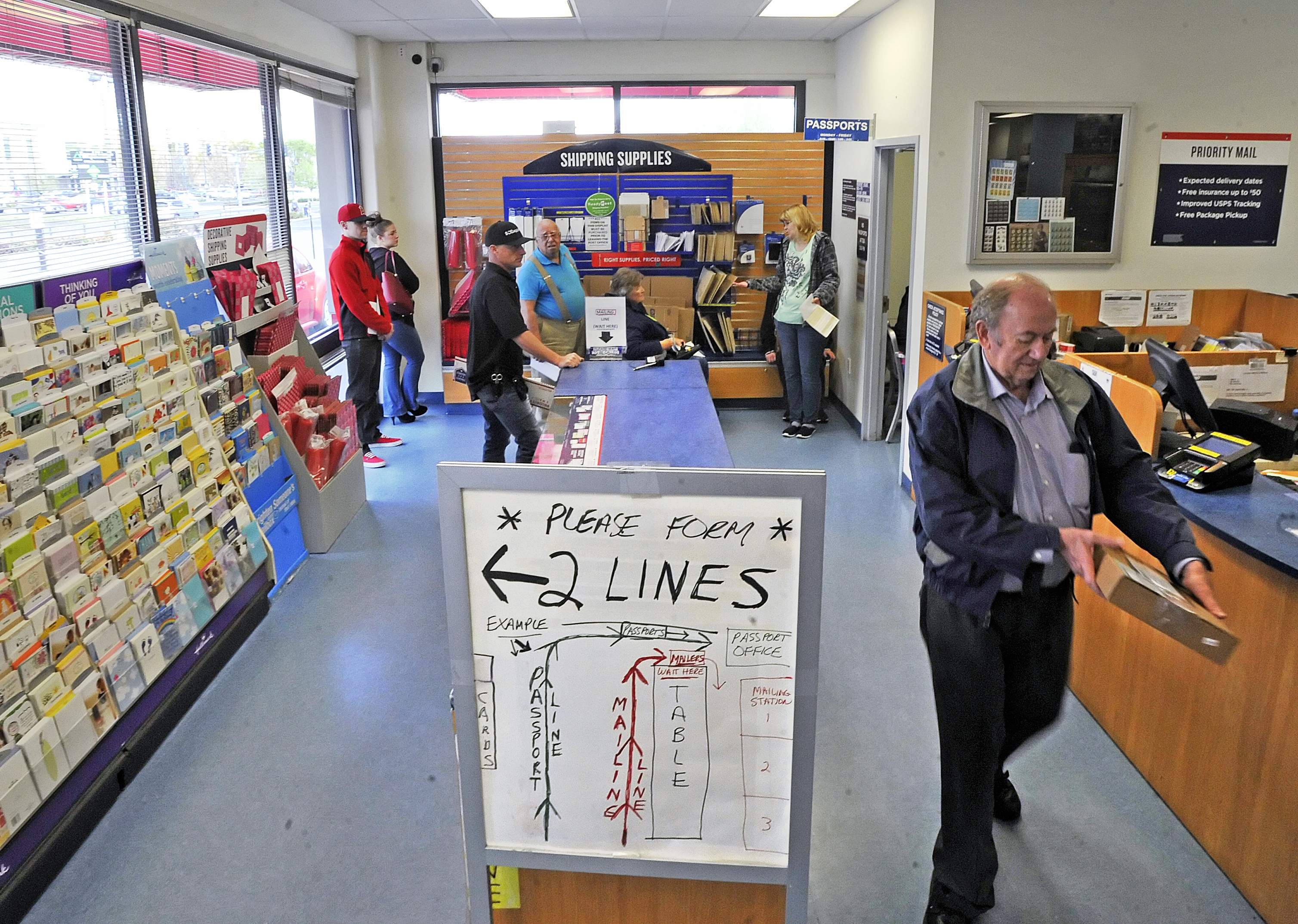 Medford residents complain about long passport lines at post office